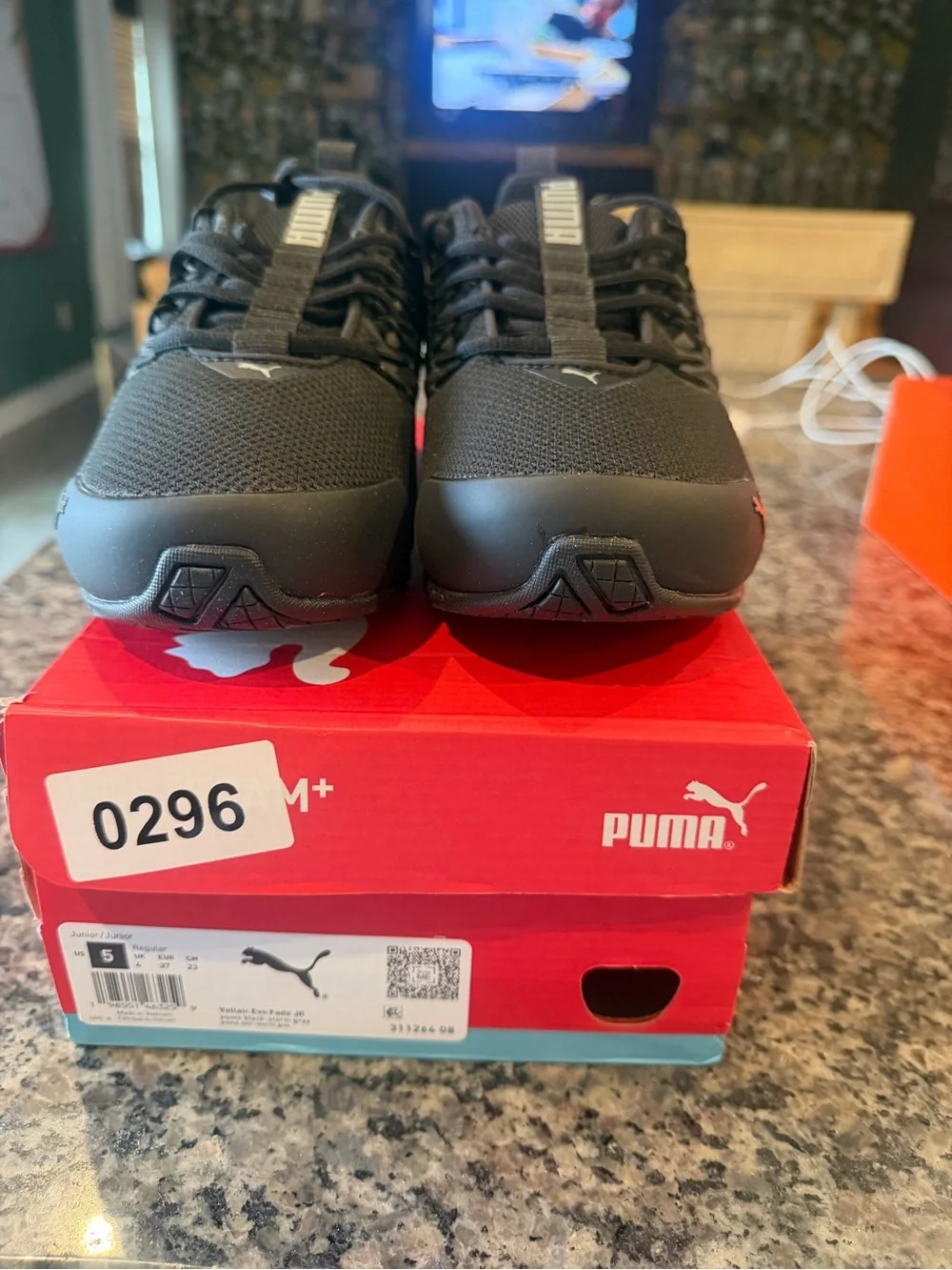 Puma Kids Black Sneaker with Silver Stripe Accents